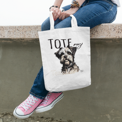 tote-bag-mockup-featuring-a-young-woman-sitting-on-a-wall-104-el