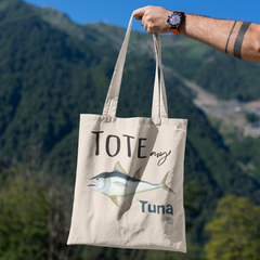 mockup-featuring-a-man-s-hand-holding-a-tote-bag-against-a-natural-scenery-3131-el1