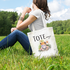 tote-bag-mockup-of-a-woman-sitting-at-a-green-meadow-23-el (2)
